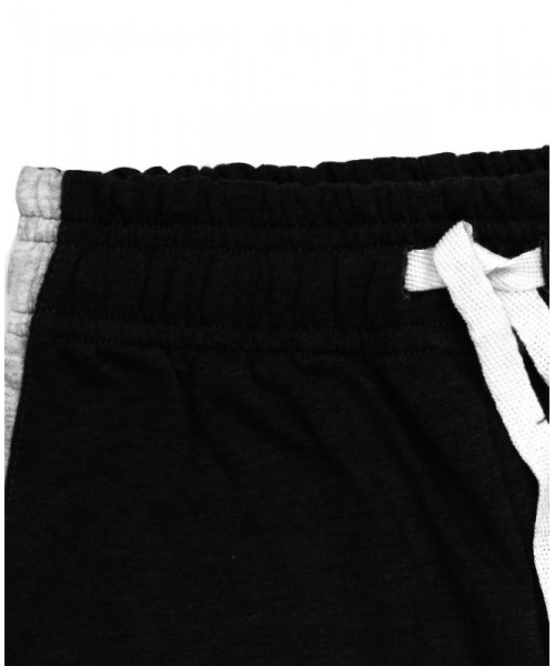 Спортивные брюки для мальчика чёрного цвета с лампасами 83975-МОС21